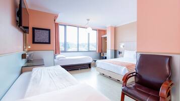 Family Room | Memory-foam beds, minibar, in-room safe, desk