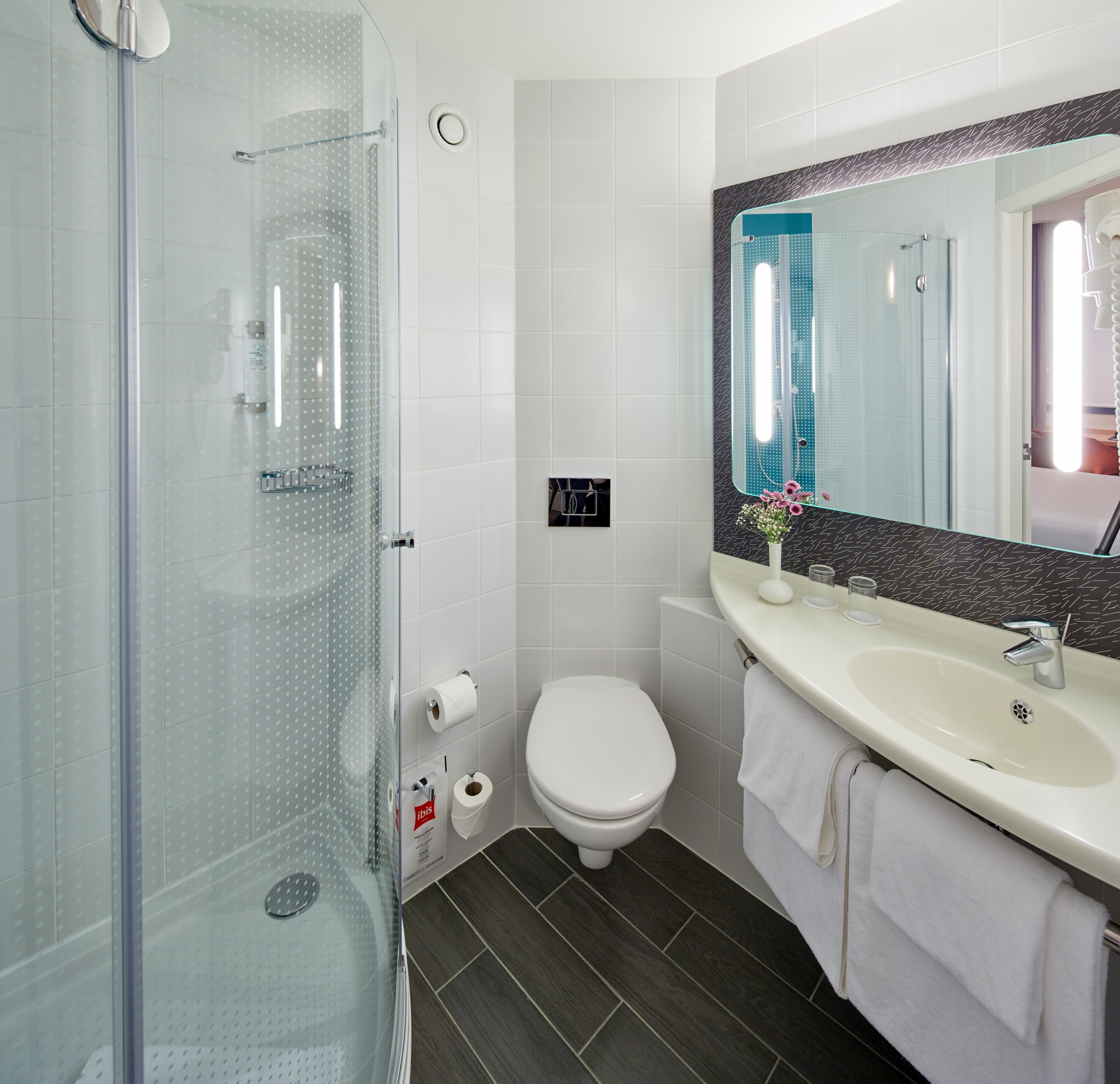shower, eco-friendly toiletries, hair dryer, towels