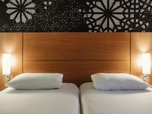 Premium bedding, desk, laptop workspace, blackout drapes