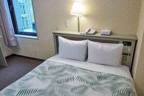 غرفة مزدوجة عادية - لغير المدخنين | خزنة داخل الغرفة ومكتب وواي فاي مجانًا وملاءات أسرّة