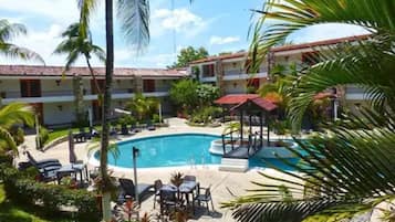 Outdoor pool, open 10:00 AM to 10:00 PM, pool loungers
