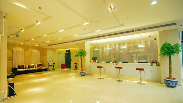 A spacious lobby with a reception desk, seating area, and potted plants. - Shanshui Trends Hotel Liu Li Qiao (Beijing)