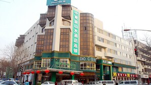 A hotel with a green facade, multiple windows, and a sign indicating it is a hotel. - Shanshui Trends Hotel Liu Li Qiao (Beijing)