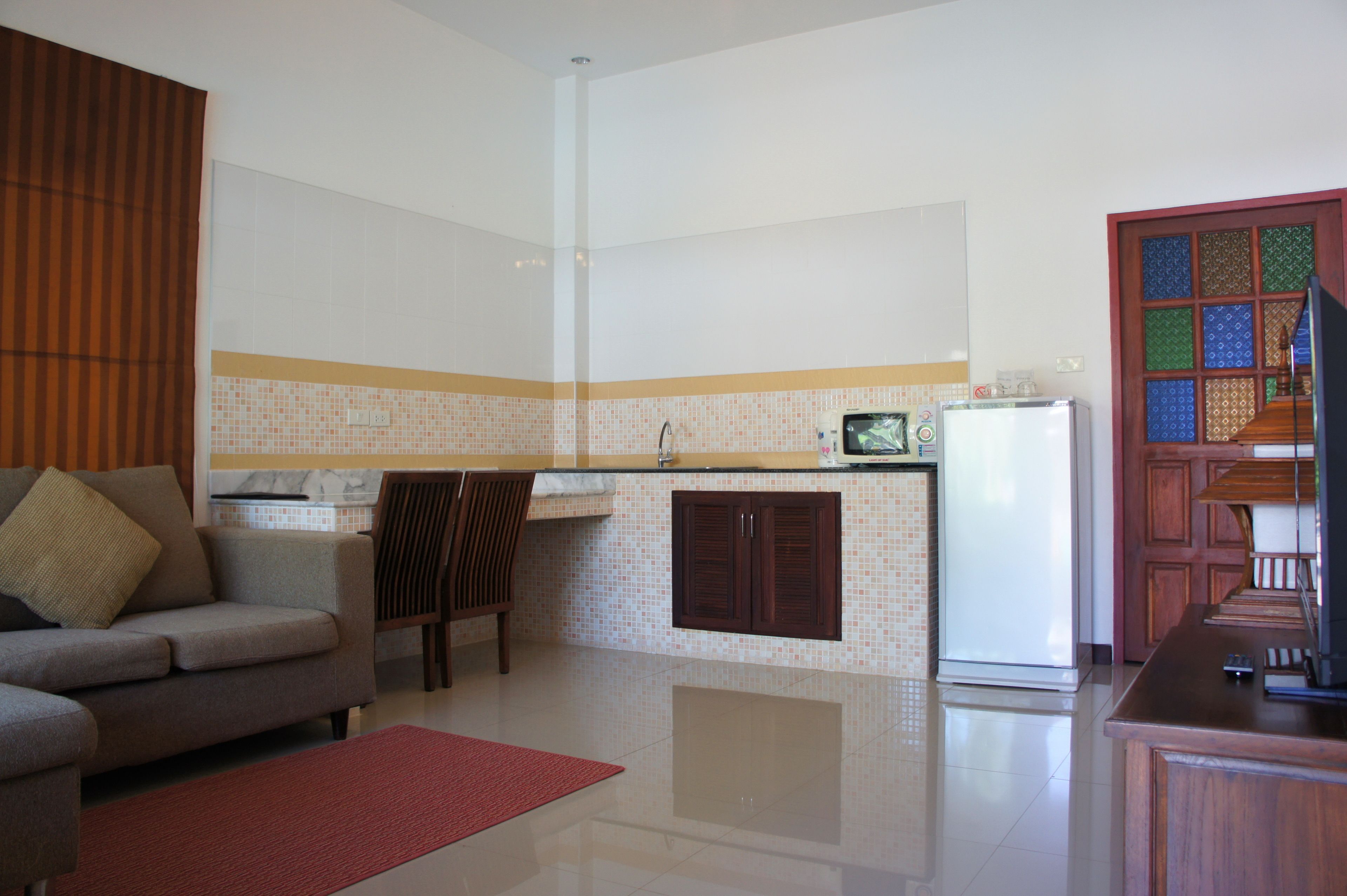 deluxe villa with pool view | living room | flat-screen tv, pay films