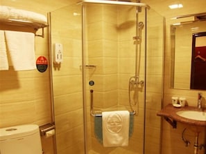 Deluxe Room, 1 King Bed | Bathroom | Shower, hair dryer, towels