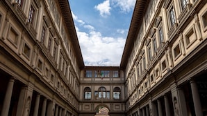 A grand architectural space with classical columns and a central open area under a clear sky. - Opera Boutique B&B (Florence)