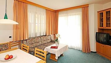 Superior Double Room | Living area | Flat-screen TV