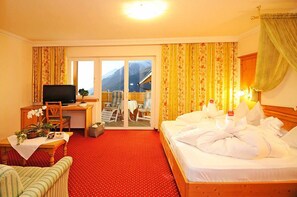 Suite | Een minibar, een kluis op de kamer, gratis wifi, beddengoed