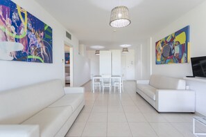 Panoramic Suite, Sea View | Living area | Flat-screen TV - 19 Summer Suites (Santa Cesarea Terme)