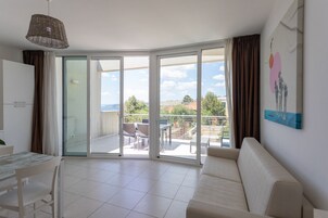 Panoramic Apartment, Sea View | Living area | Flat-screen TV