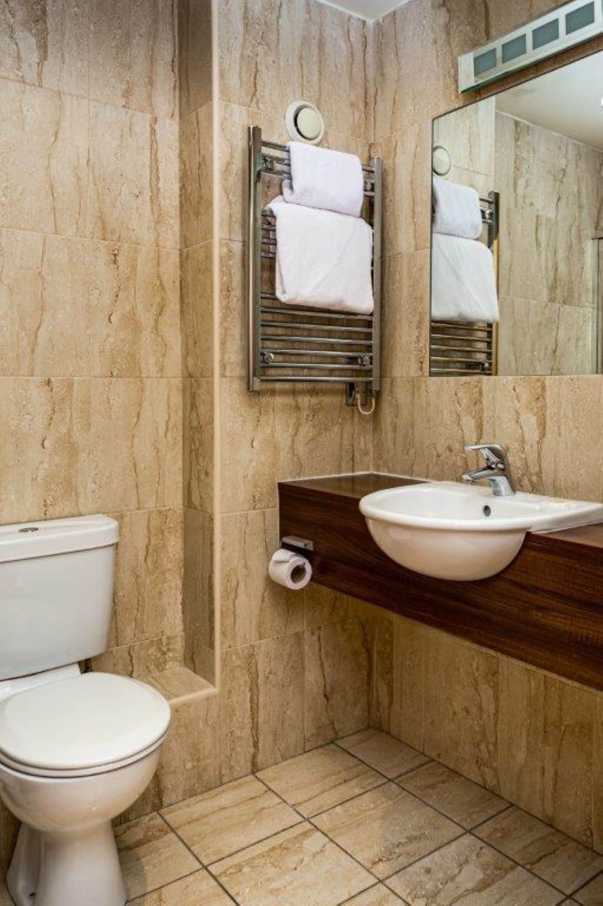 junior suite | bathroom | spring water bathtub, designer toiletries, hair dryer, towels