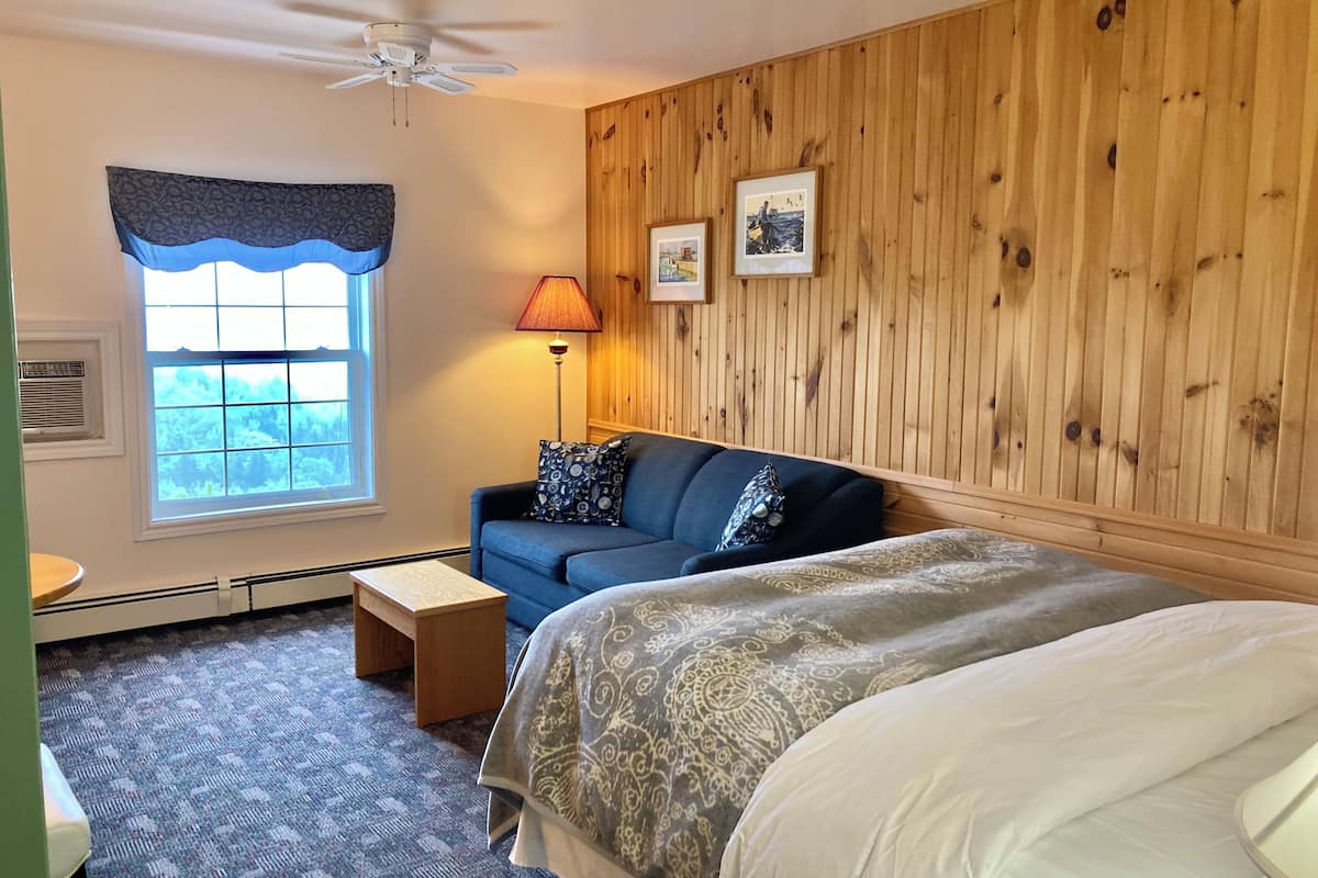 deluxe room, 1 queen bed with sofa bed, ocean view | 1 bedroom, premium bedding, iron/ironing board, free wifi