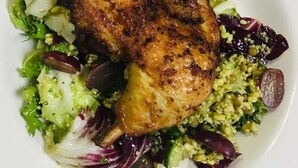 A plate of food with a roasted chicken, salad, and vegetables. - Holiday Inn Express Manchester Airport by IHG (Manchester)