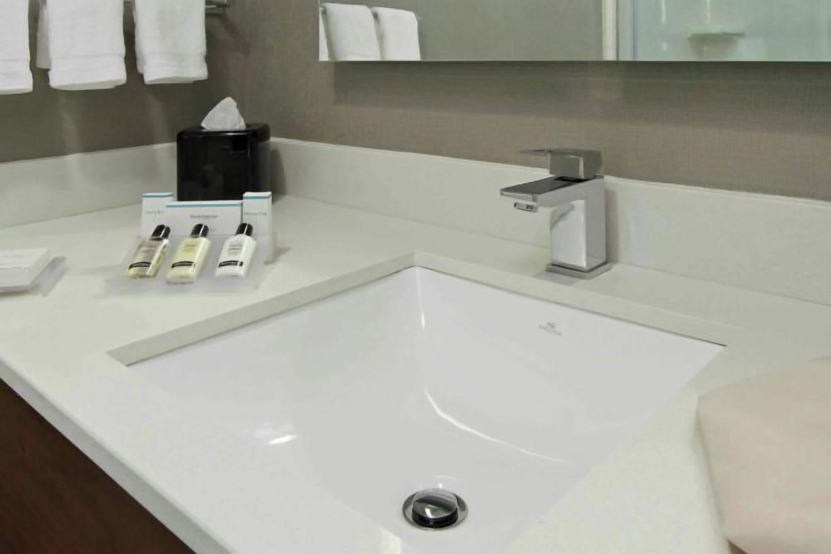 Shower, designer toiletries, hair dryer, towels