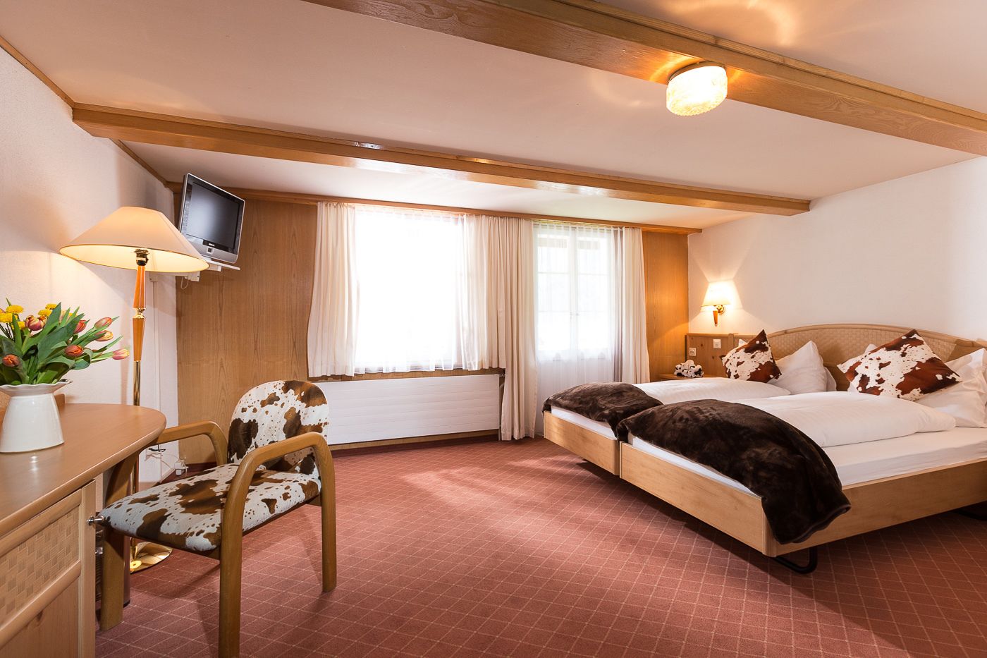 double or twin room, 2 single beds, balcony, mountain view | down duvets, individually decorated, desk, blackout curtains