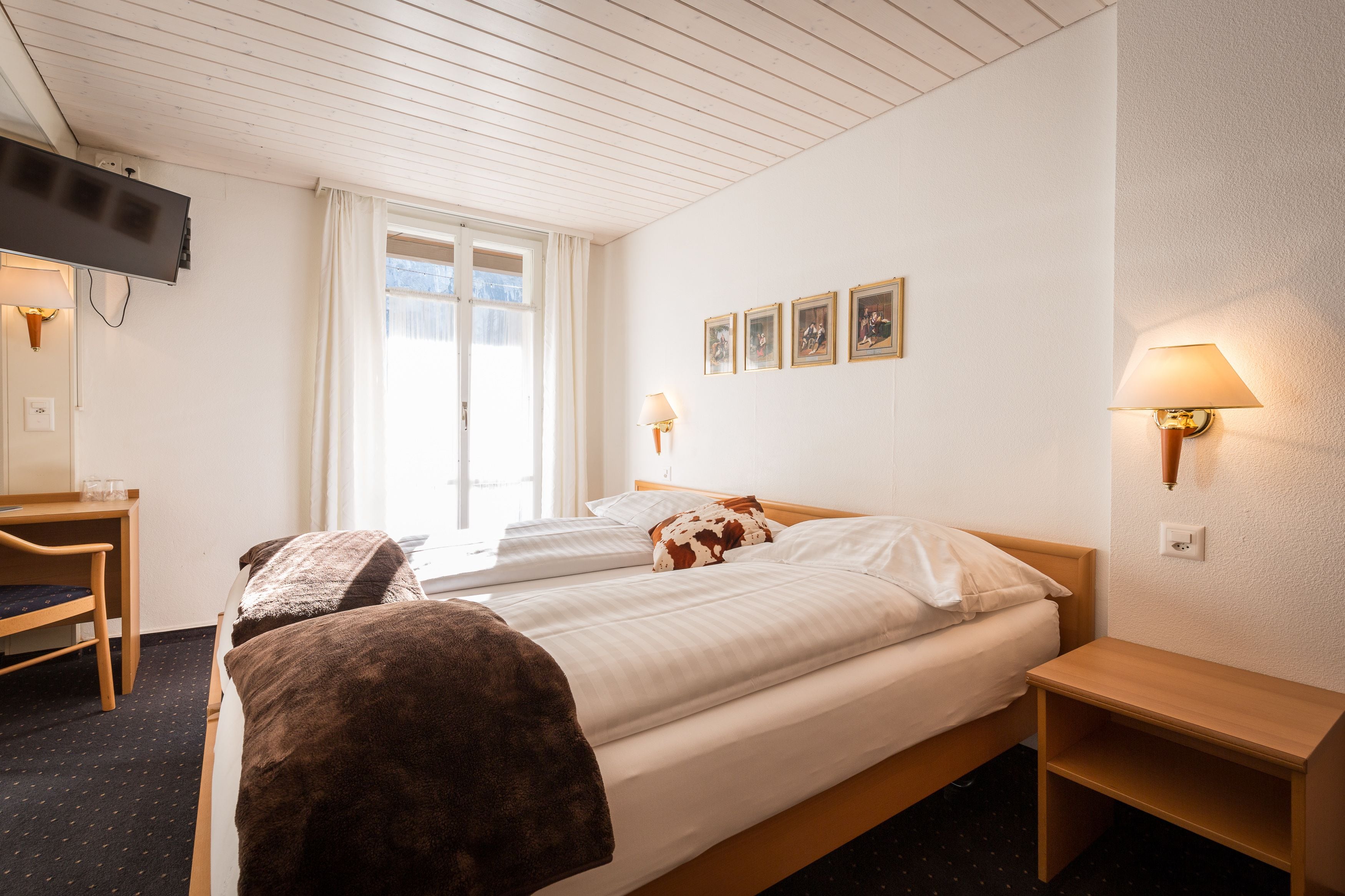 double or twin room, 2 single beds, balcony, mountain view | down duvets, individually decorated, desk, blackout curtains