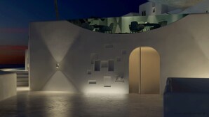 A modern architectural design with a central archway, recessed seating areas, and a minimalist aesthetic. - Absolute Mykonos Suites & More (Mykonos)
