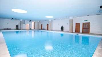 Indoor pool, outdoor pool, pool umbrellas, sun loungers