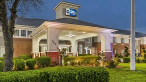 A Best Western hotel with a covered entrance, brick facade, and well-maintained landscaping. - Best Western Fort Worth Inn & Suites (Fort Worth)