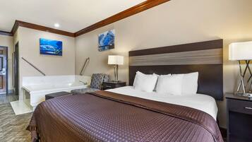 Suite, 1 King Bed, Non Smoking, Jetted Tub (Oversized Room) | Desk, laptop workspace, blackout drapes, iron/ironing board