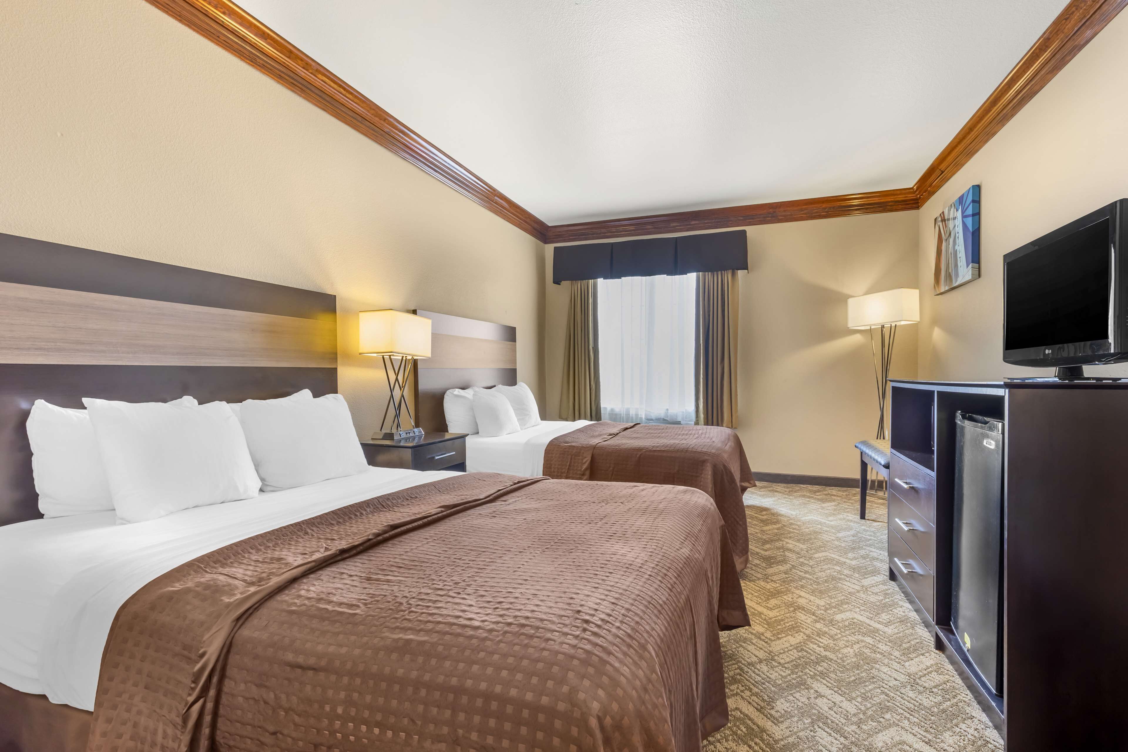 suite, 2 queen beds, non smoking, refrigerator & microwave (with single sofabed) | desk, laptop workspace, blackout curtains, iron/ironing board