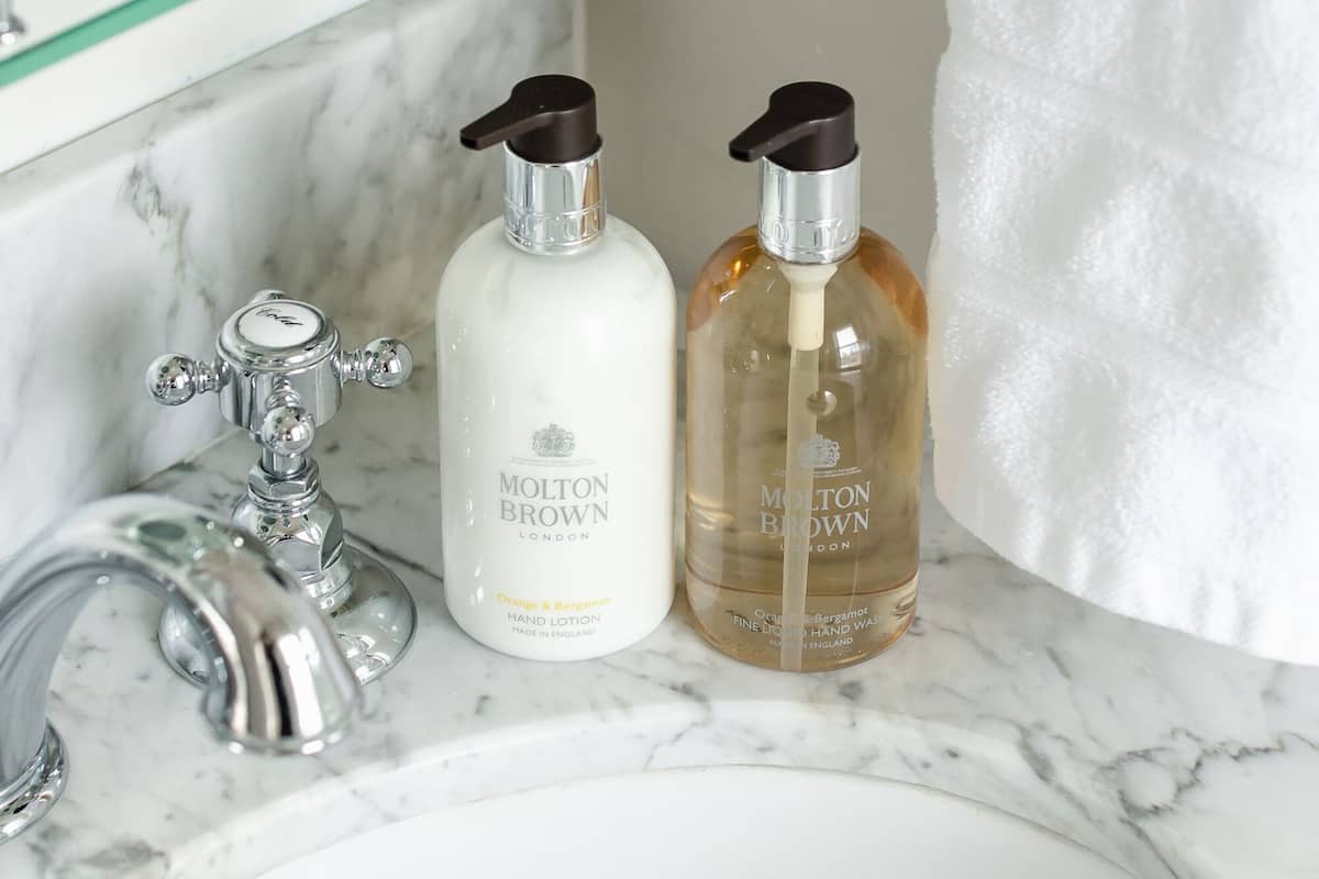 designer toiletries, hair dryer, bathrobes, slippers