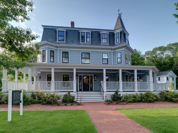 A large, two-story house with a wrap-around porch, a chimney, and a sign indicating it is a bed and breakfast. - The Inn at Hastings Park, Relais & Chateaux - Boston (Lexington)