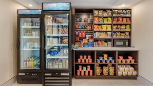 A vending machine area with various snacks, drinks, and frozen foods. - Red Roof Inn Bourbonnais (Bourbonnais)