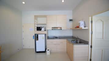 Suite, 1 Bedroom | Private kitchen | Fridge, microwave, coffee/tea maker