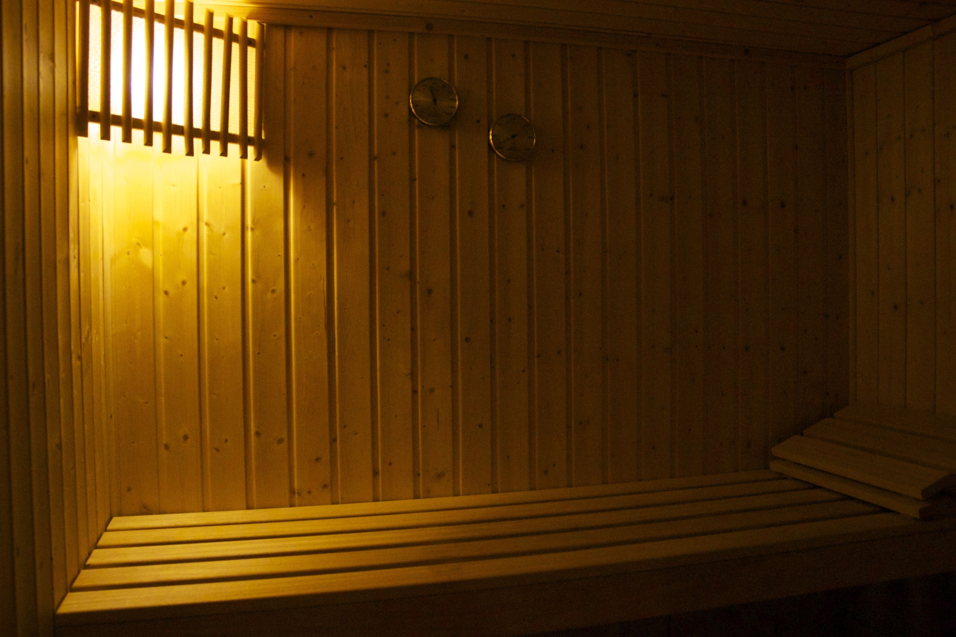 A sauna with wooden walls and benches.