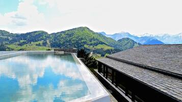 Indoor pool, seasonal outdoor pool, pool umbrellas, pool loungers