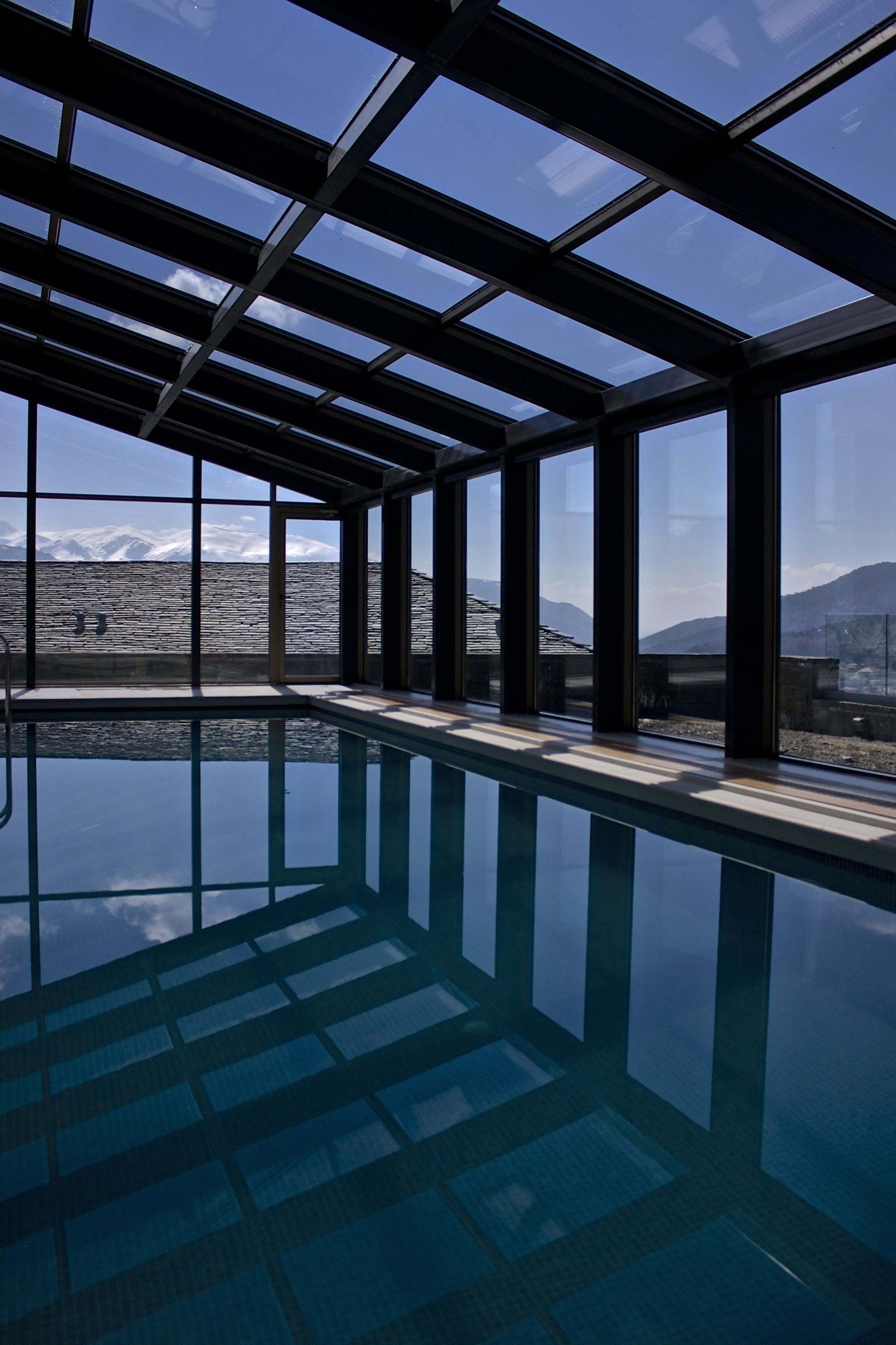 indoor pool, seasonal outdoor pool, pool umbrellas, pool loungers