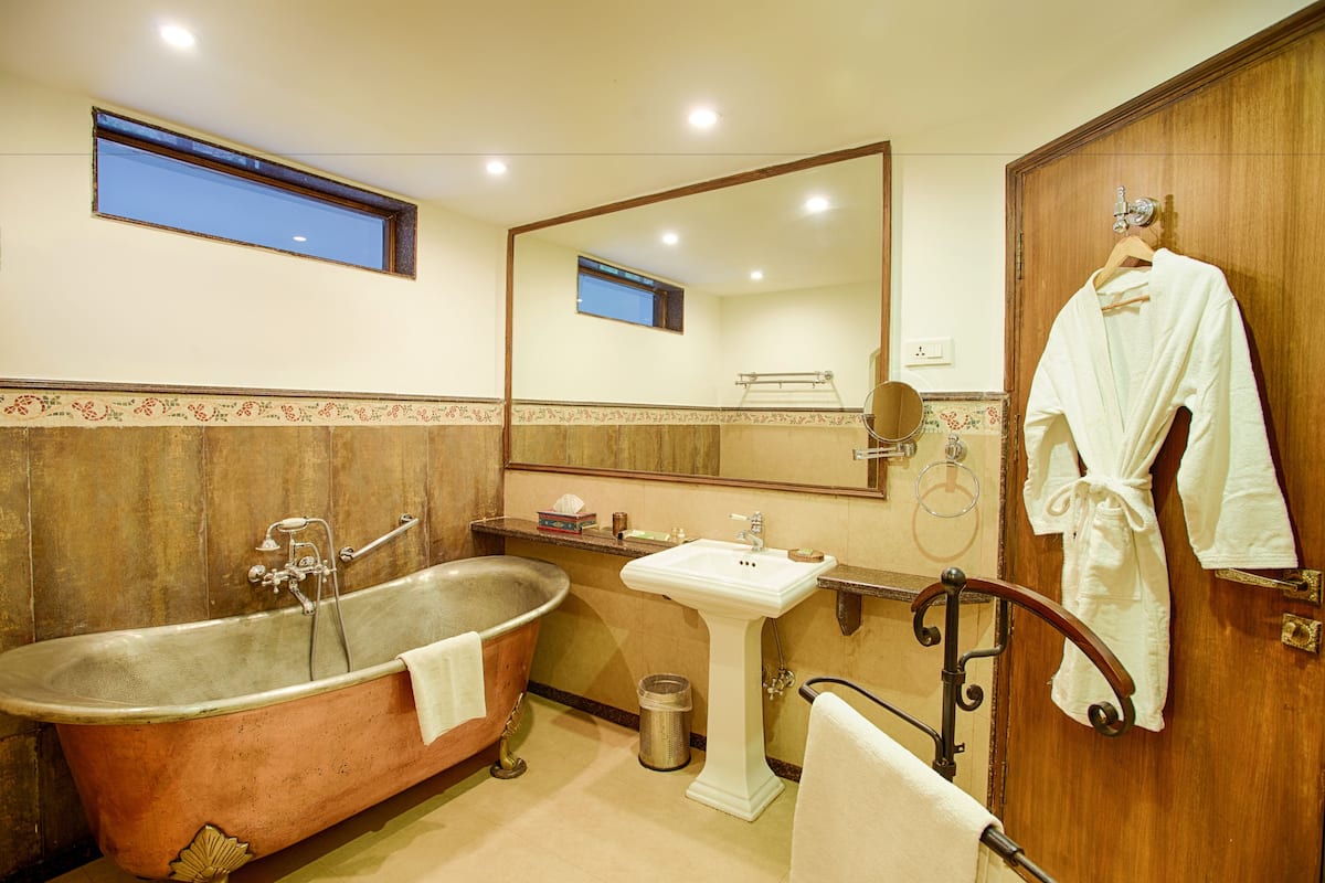 separate bathtub and shower, jetted bath, rainfall showerhead