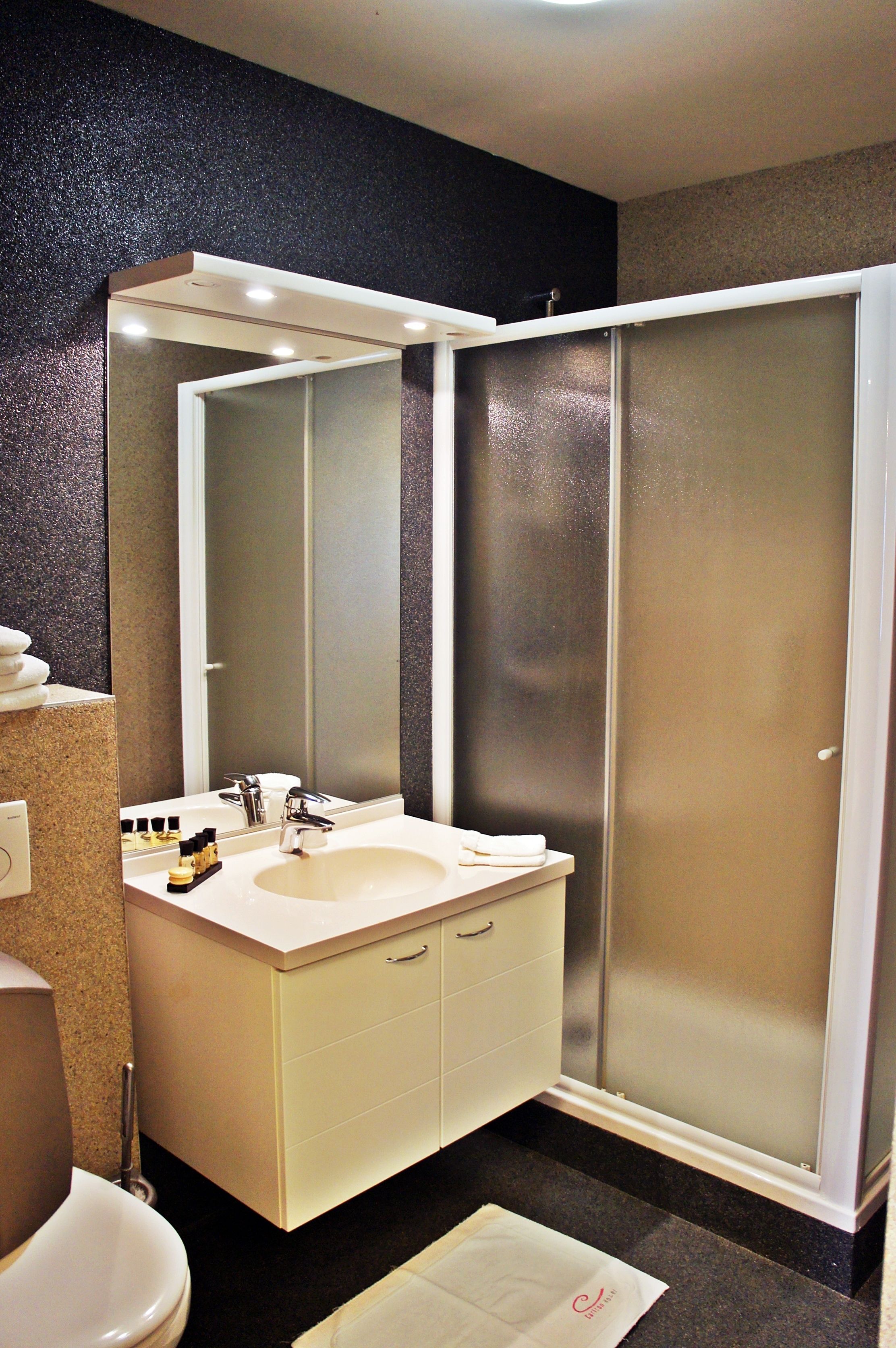 family room | bathroom | shower, free toiletries, hair dryer, bathrobes