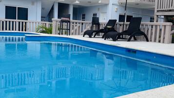 Outdoor pool, open 10:00 AM to 10:00 PM, sun loungers