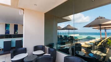 Outdoor pool, open 7 AM to 10 PM, pool umbrellas, pool loungers