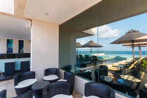 Outdoor pool, open 7 AM to 10 PM, pool umbrellas, sun loungers