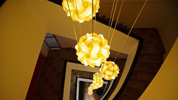 A staircase with a modern design, featuring a unique geometric pattern on the walls and a central window. - Clock Inn Colombo (Colombo)