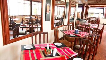 Breakfast, lunch served; international cuisine, al fresco dining