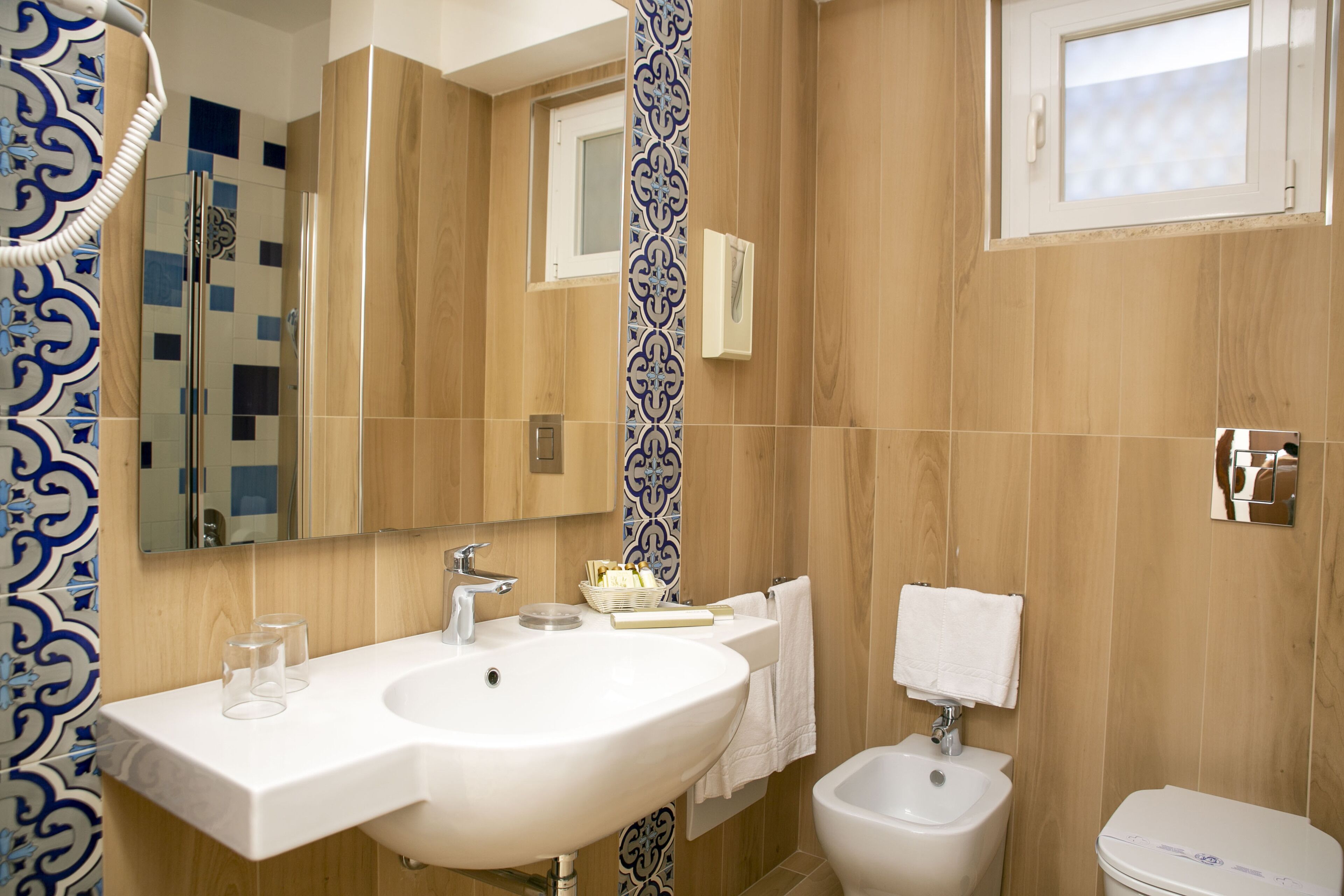 free toiletries, hair dryer, bidet, towels