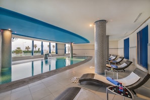 Indoor pool, outdoor pool, pool umbrellas, pool loungers