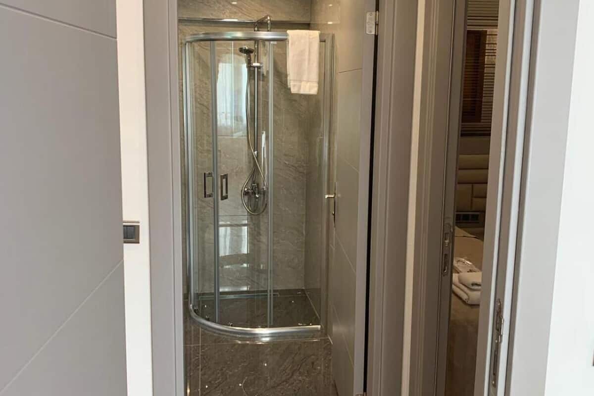 Family Suite, 2 Bedrooms | Bathroom | Shower, free toiletries, hair dryer, bathrobes