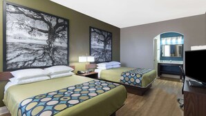 A hotel room with two beds, a TV, a desk, and a bathroom mirror. - Super 8 by Wyndham San Antonio Near Fort Sam Houston (San Antonio)