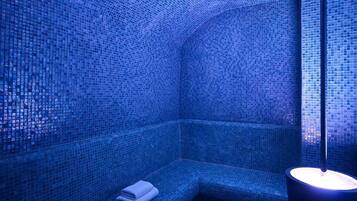 Relax in a serene, enclosed space with a bench and towel, perfect for unwinding.