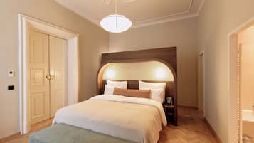 A bedroom with a bed, bench, wooden headboard, and a light fixture.