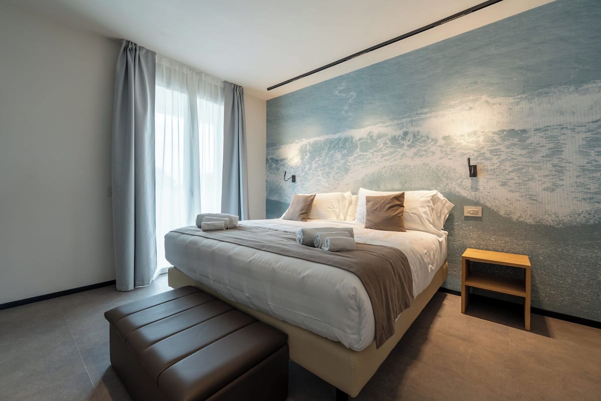 Suite | Premium bedding, down comforters, memory foam beds, minibar