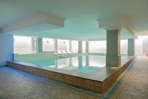Indoor pool, seasonal outdoor pool, pool umbrellas, pool loungers
