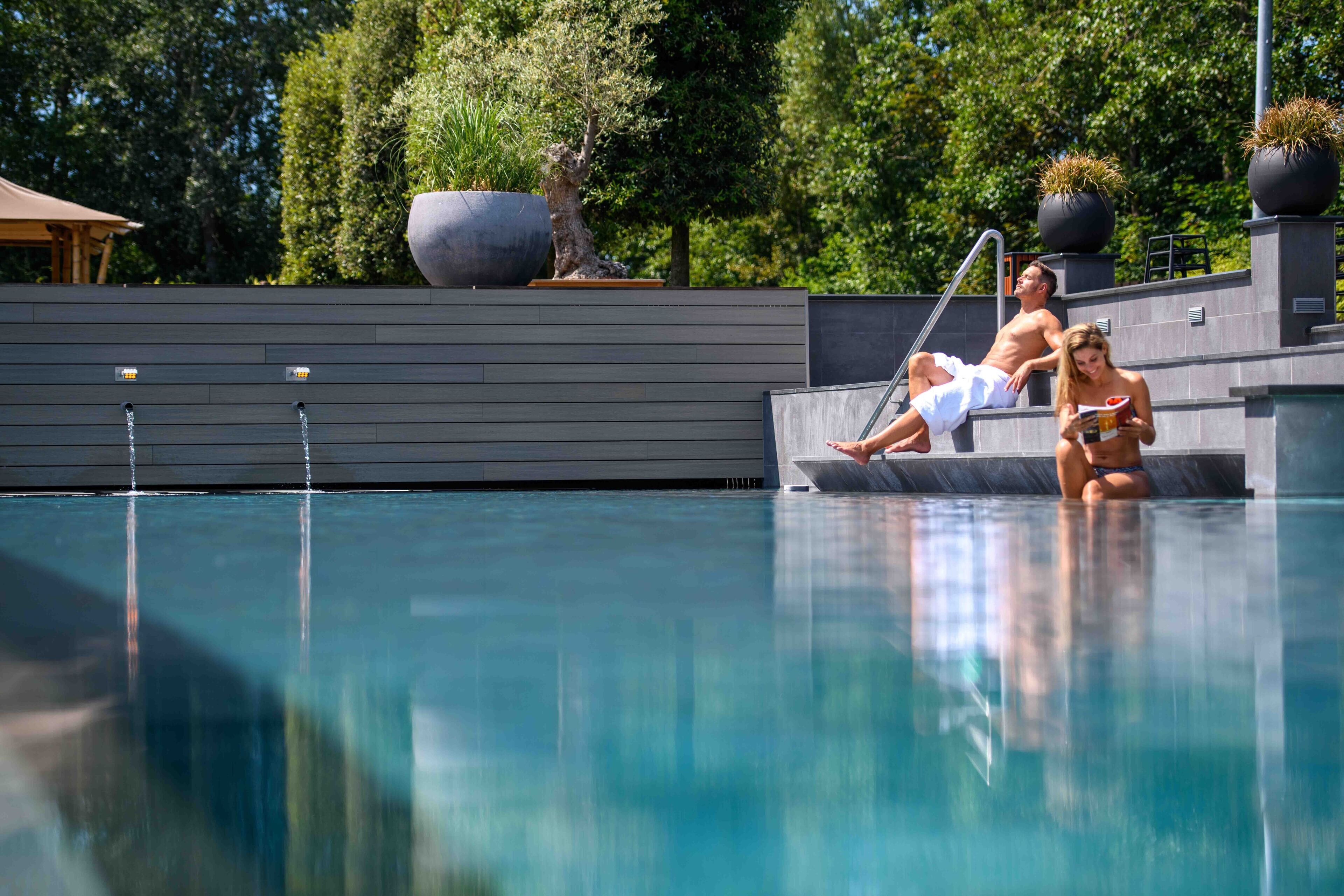 indoor pool, outdoor pool, pool umbrellas, pool loungers