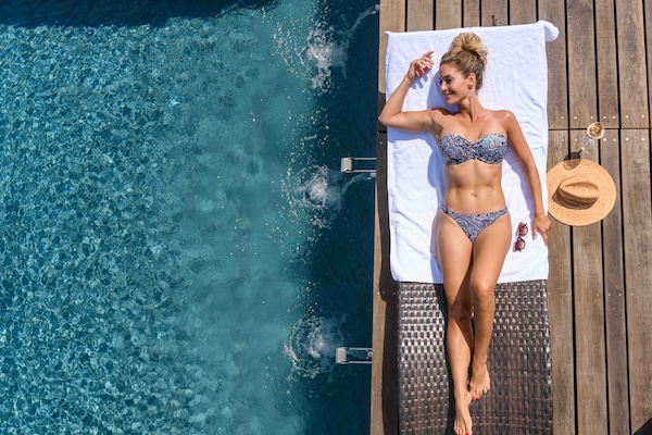 Indoor pool, outdoor pool, pool umbrellas, pool loungers