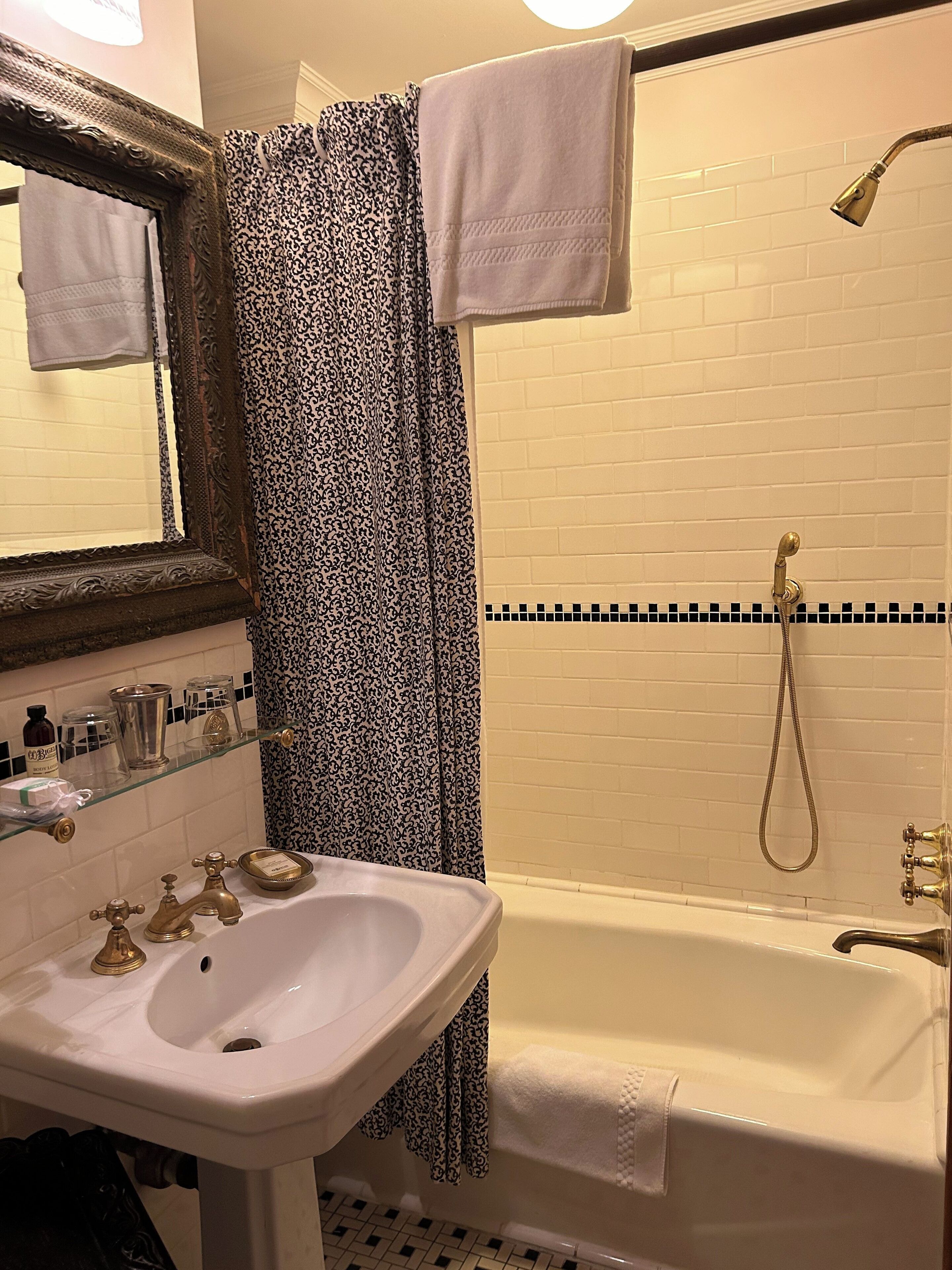 signature room, 1 king bed | bathroom | combined shower/bathtub, free toiletries, hair dryer, towels